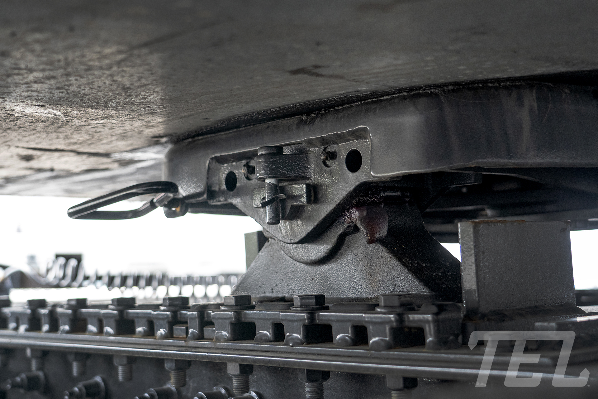 Image showing the 5th wheel plate on a TEL tractor properly locking on a trailer kingpin.