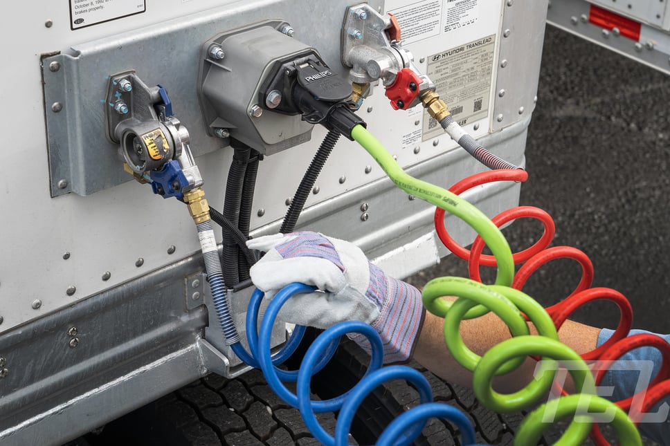 Air lines and lighting cord properly installed on a TEL Trailer